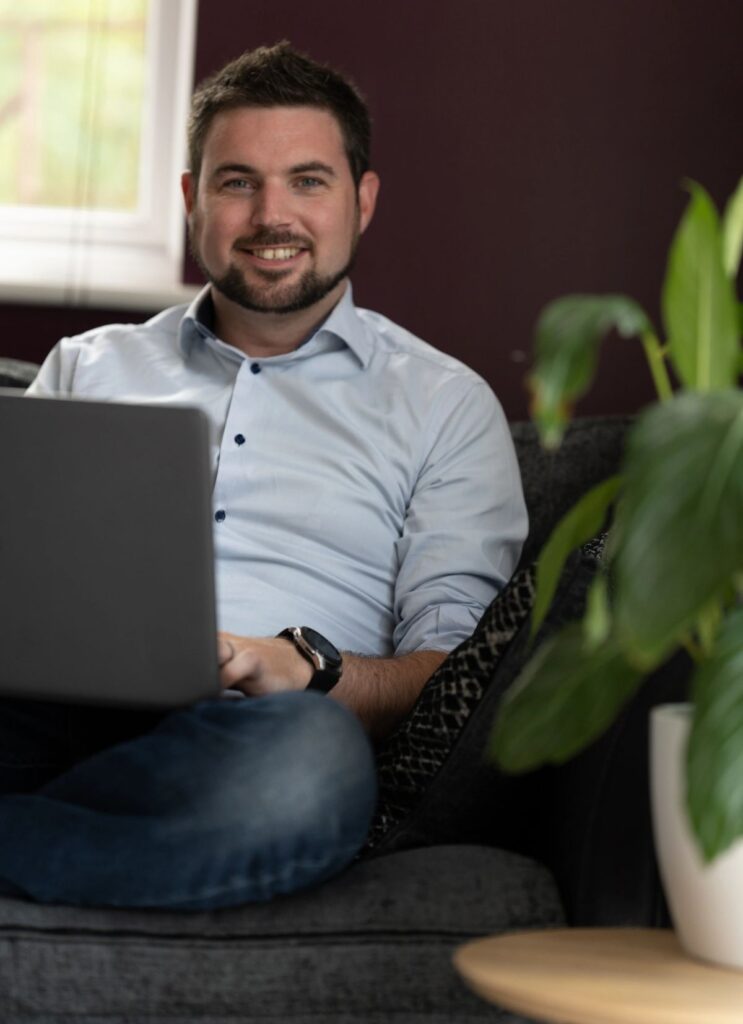 Dan Coppins working at a laptop